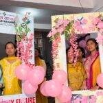Polling officers pose for a photo at the pink polling station established by District Election Officer (DEO) Saloni Rai to attract female voters to cast their votes on the eve of the first phase of Lok Sabha Polls, in Udhampur on Thursday