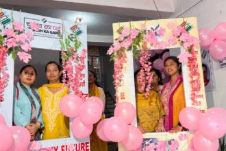 Polling officers pose for a photo at the pink polling station established by District Election Officer (DEO) Saloni Rai to attract female voters to cast their votes on the eve of the first phase of Lok Sabha Polls, in Udhampur on Thursday